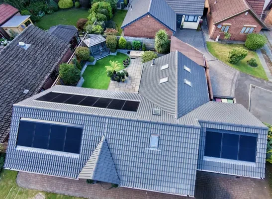Aerial view of completed solar panel installation on a UK residential roof