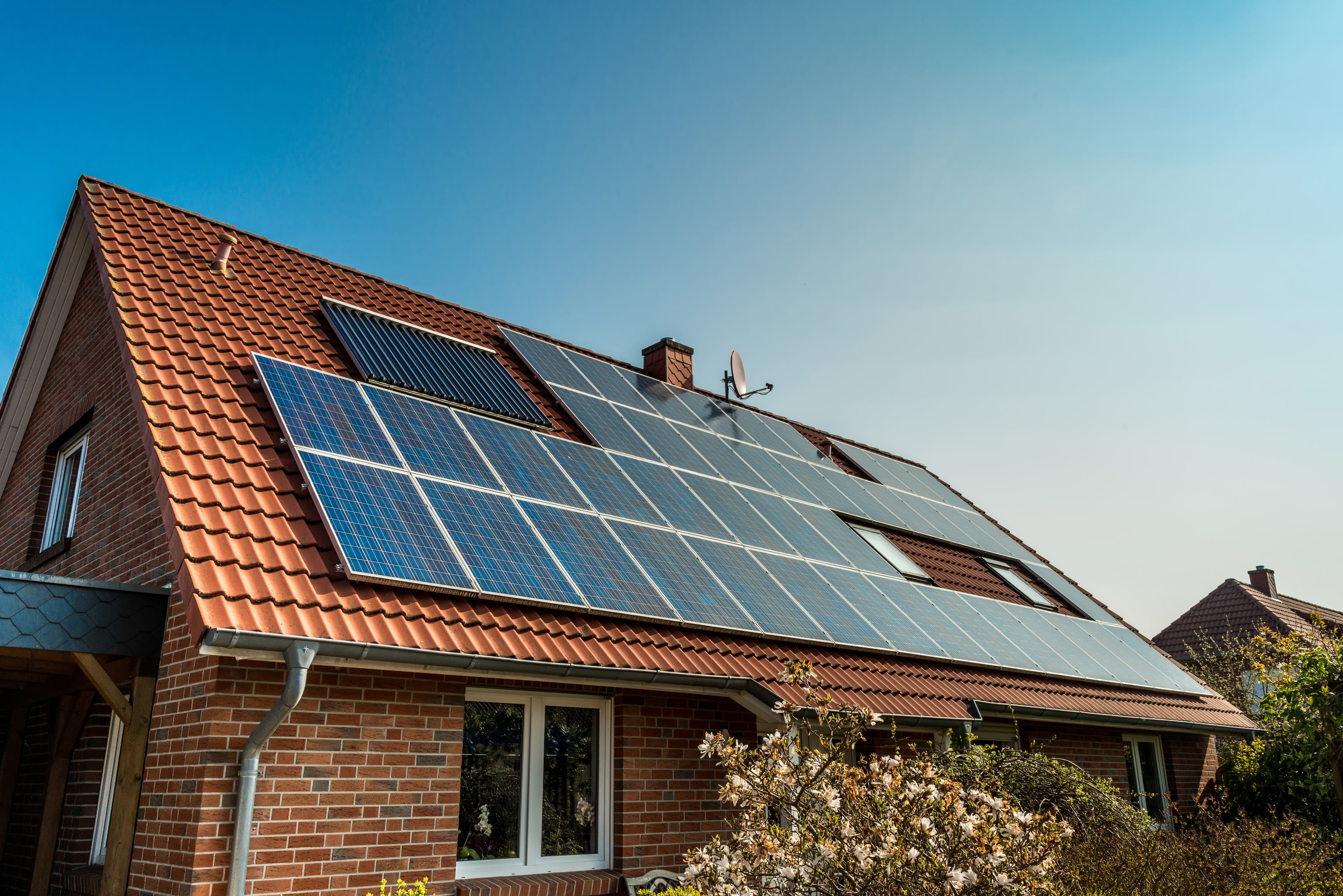 UK semi-detached house with solar panels installed on roof
