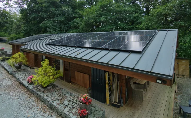 Solar panels on a modern timber-clad lodge building
